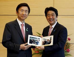 Japans Abe pledges to improve ties with S. Korea