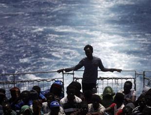 In tense talks, EU leaders agree plan to confront migrant crisis