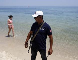 Armed Tunisian police swarm streets of tourist towns