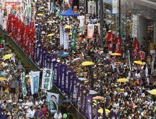 Democracy camp seeks new direction at Hong Kong protest march
