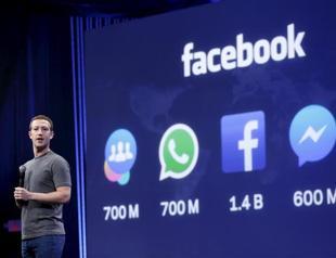 Facebook profit down but revenues, user base grow