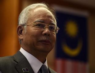 Malaysian police raid 1MDB office, PM weighs legal options