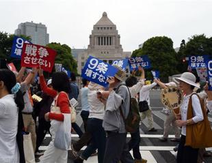 Japan lawmakers pass security bills despite public anger