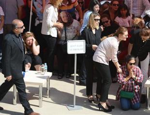 Taiwanese woman says farewell to slain Turkish husband policeman with traditional prayers