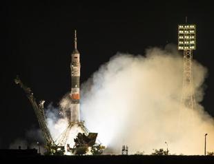 Rocket carrying Russian, Japanese, US crew docks with ISS