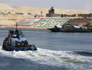 Egypt says new Suez Canal ready for business