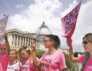 Iran bans newspaper of nuclear deal critic, warns others