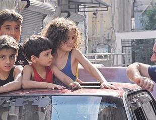 The other Syria: Rockets there, weddings here