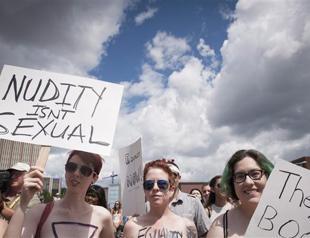 Hundreds in Canada rally for women’s topless rights