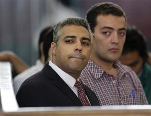 Egypt court again postpones verdict in Jazeera reporters retrial