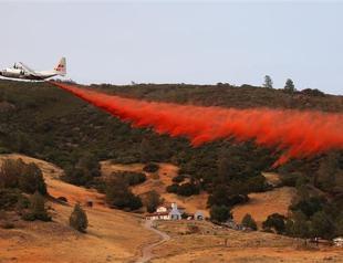 Northern California wildfire doubles in size, displaces thousands