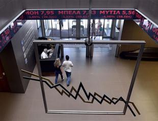 Greek stocks plunge 22 percent as bourse reopens