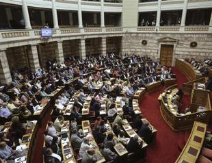 Greek lawmakers back 3rd bailout after all-night debate