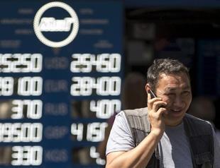 Kazakh currency falls 23 percent after switch to free-float
