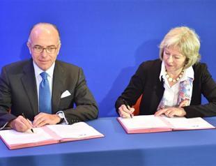 Britain to help fund Calais migrants aid, asylum processing