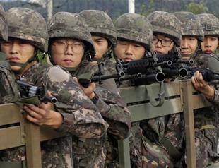 North, South Korea defuse crisis after marathon talks