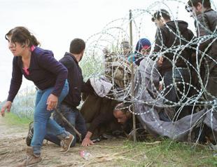 Hungary moves to secure border with more men, dogs, gas