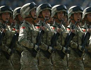 China holds massive military parade, to cut troop levels by 300,000