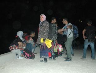 Human smugglers set inflatable boat aflame and vanish, after migrants object to boat