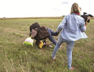 Hungarian TV journalist fired for tripping up fleeing migrants