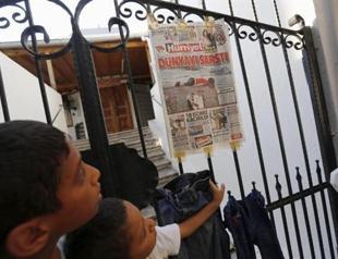 Turkey charges four Syrians over boat deaths as journalists flock to migrant beach