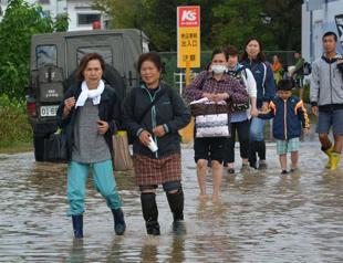 Thousands of rescuers deployed as Japan floods kill three