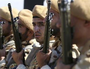 Using Russias cover, Iran begins sending fighters to Syria