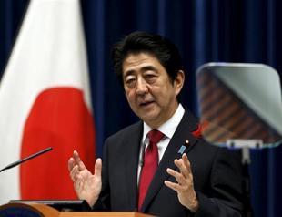 Japans Abe hails new trade era, hopes China will join pact