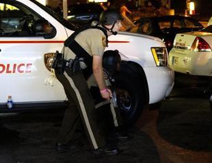 Shots fired as Ferguson marks anniversary of teens death