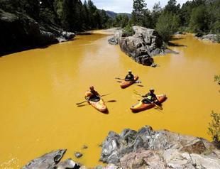 US anti-pollution workers turn river orange in toxic spill