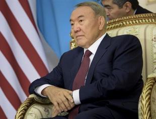 Energy-rich Kazakhstan dismisses national bank head as currency slumps