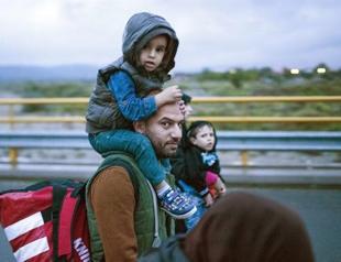 50,000 Syrian refugees heading to Turkey, sources say