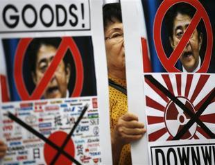 Japan economy shrinks in setback for ‘Abenomics’