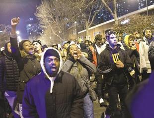 Chicago charges officer in black teen’s death, releases video of shooting