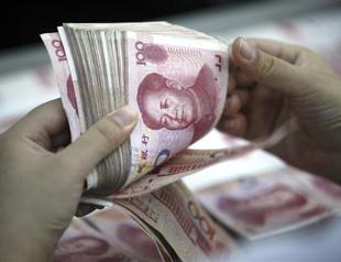 China stocks jump on US rally, yuan edges up