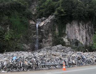 Floodwater reveals illegal dumping site in Black Sea town