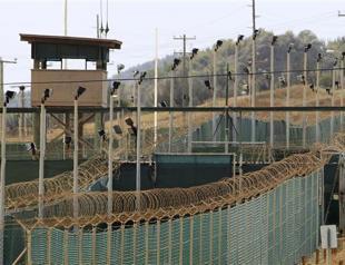 Obama signs bill making Guantanamo prison closure tougher