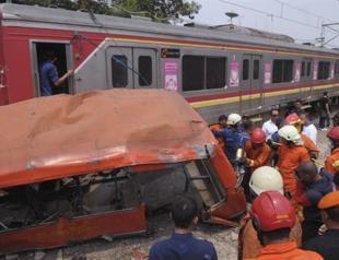 Bus and train crash in Indonesia kills 16