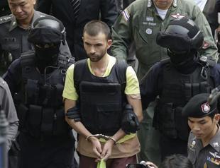 Thai police lead key suspects to Bangkok bomb site for re-enactment