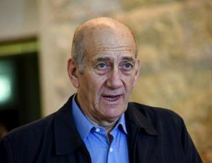 Former Israeli PM Olmerts jail term cut, cleared of main charge