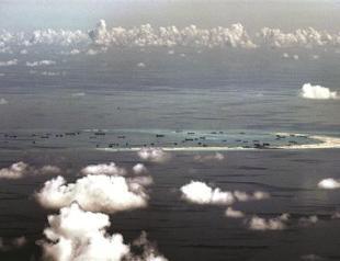 China naval chief warns US of conflict risk in South China Sea