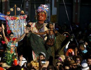 Rio Carnival dances toward wild finale, swatting Zika aside