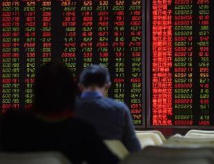 OECD cuts 2016 growth forecast, addresses risks emerging markets