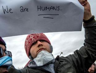 Iranian migrants sew mouths shut to protest ‘Jungle’ demolition