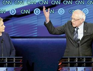 Clinton dodges bullets by Sanders, hits out at Trump