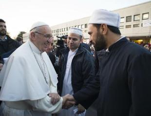 Pope washes feet of Muslim migrants, says ‘We are brothers’