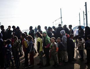 Turkey PM says returns under EU migrant deal to begin on April 4