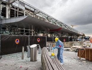 Brussels Airport reopens with three flights, tighter security