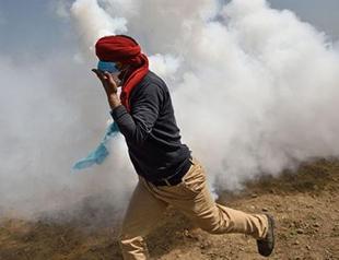 Macedonian police fire tear gas at migrants on Greek border