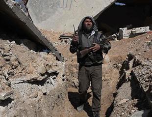 Rebels launch attacks in western Syria, heavy government air raids: monitor